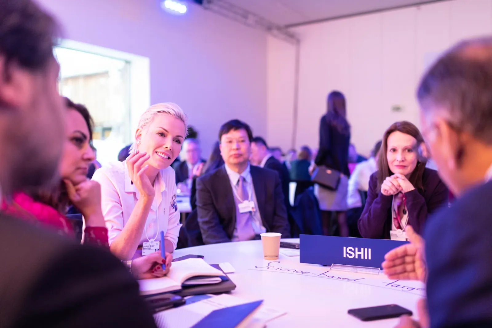 Accounting and finance professionals in conversation in an office